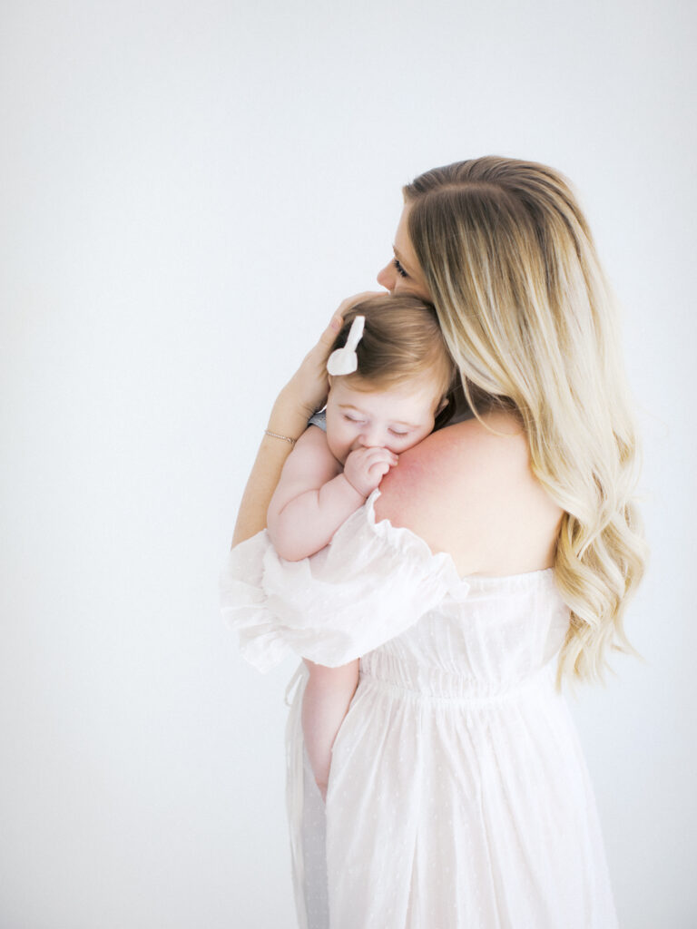 A six month family session in studio by Orlando newborn photographer.