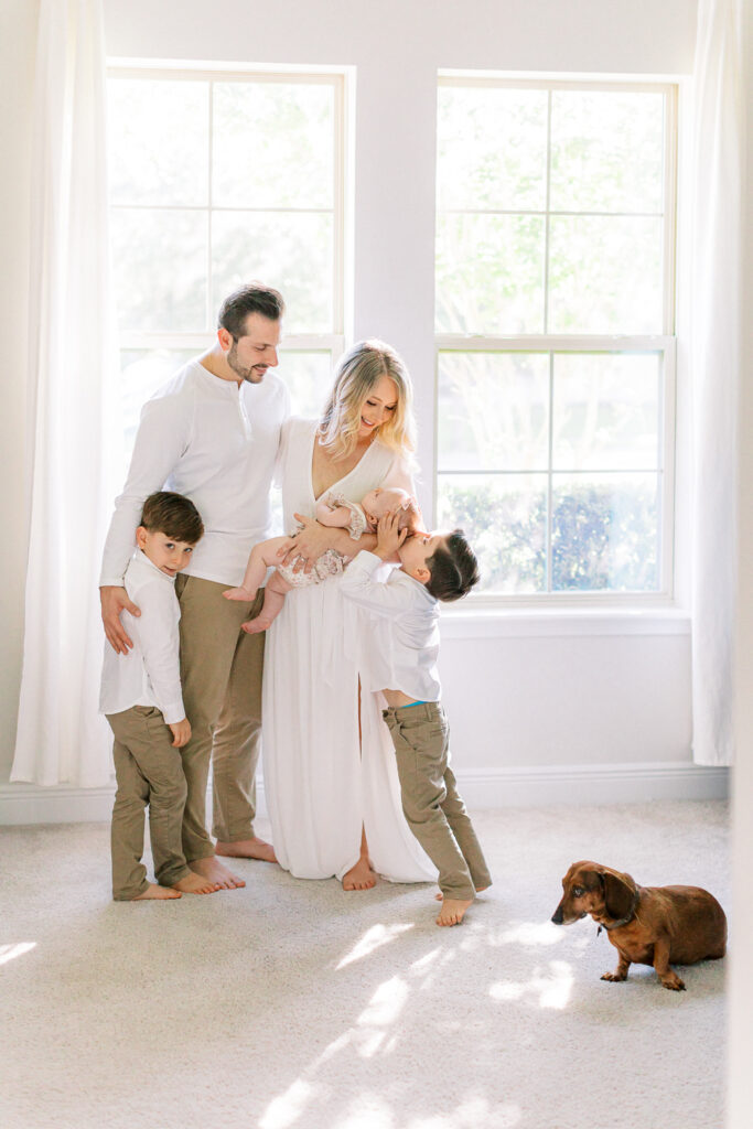 Welcoming a new sibling by Orlando newborn photographer.