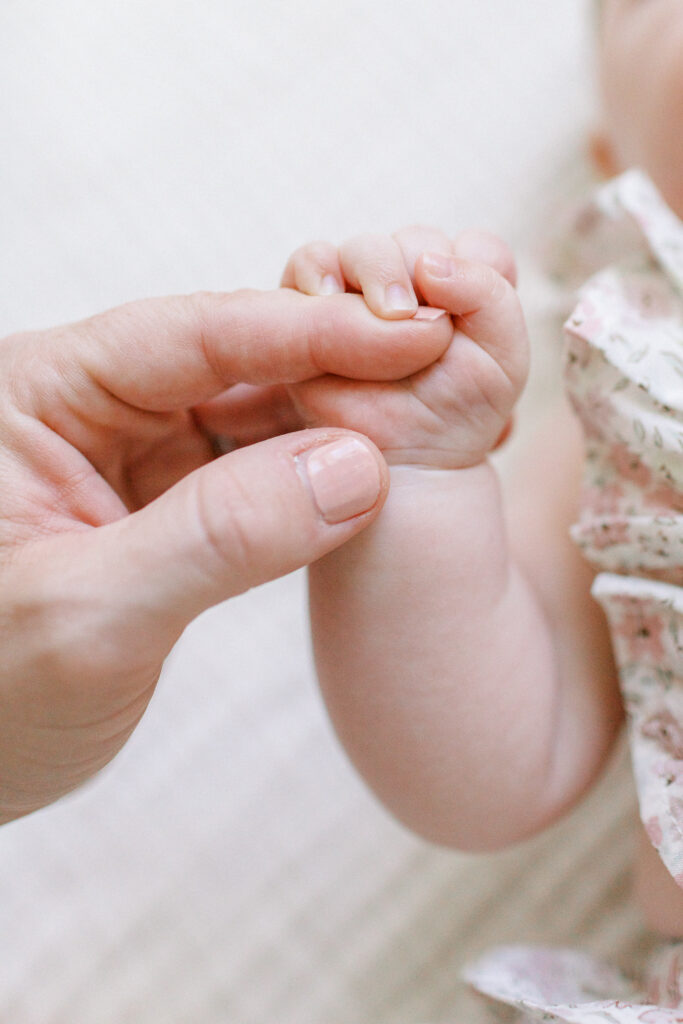 Baby girl details at home in by Orlando newborn photographer.