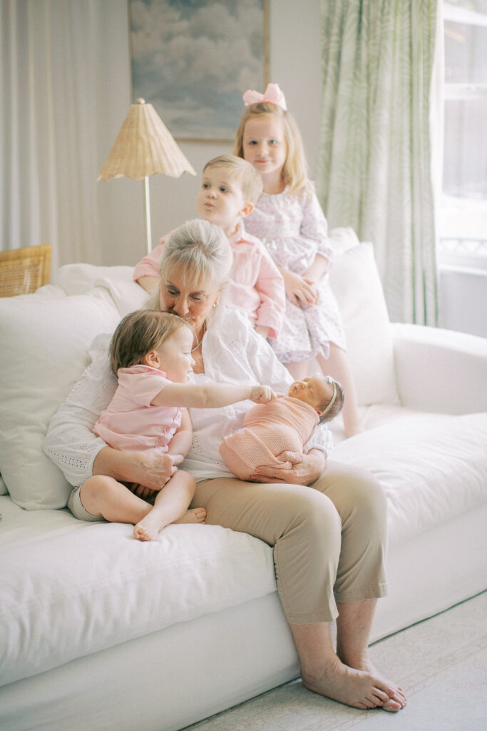 Sweet moment captured of Grandma with all her grand babies at home during lifestyle newborn shoot