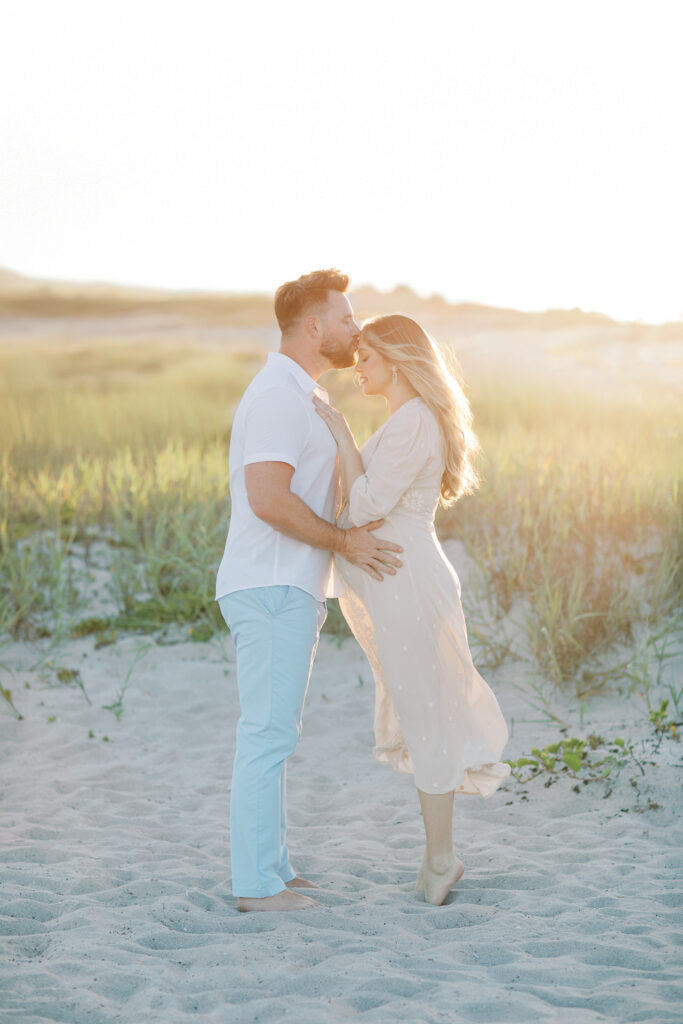 Intimate moment of parents-to-be during sunset photography session in Orlando