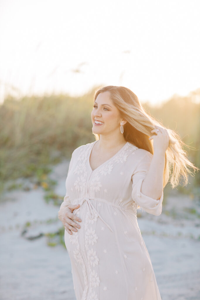 Orlando maternity photography showing mother in blush gown during natural light session