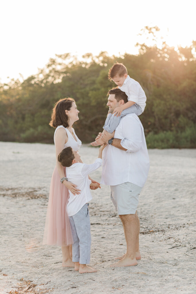 Family members sharing a joyful moment during a natural lifestyle photoshoot with Orlando family photographer