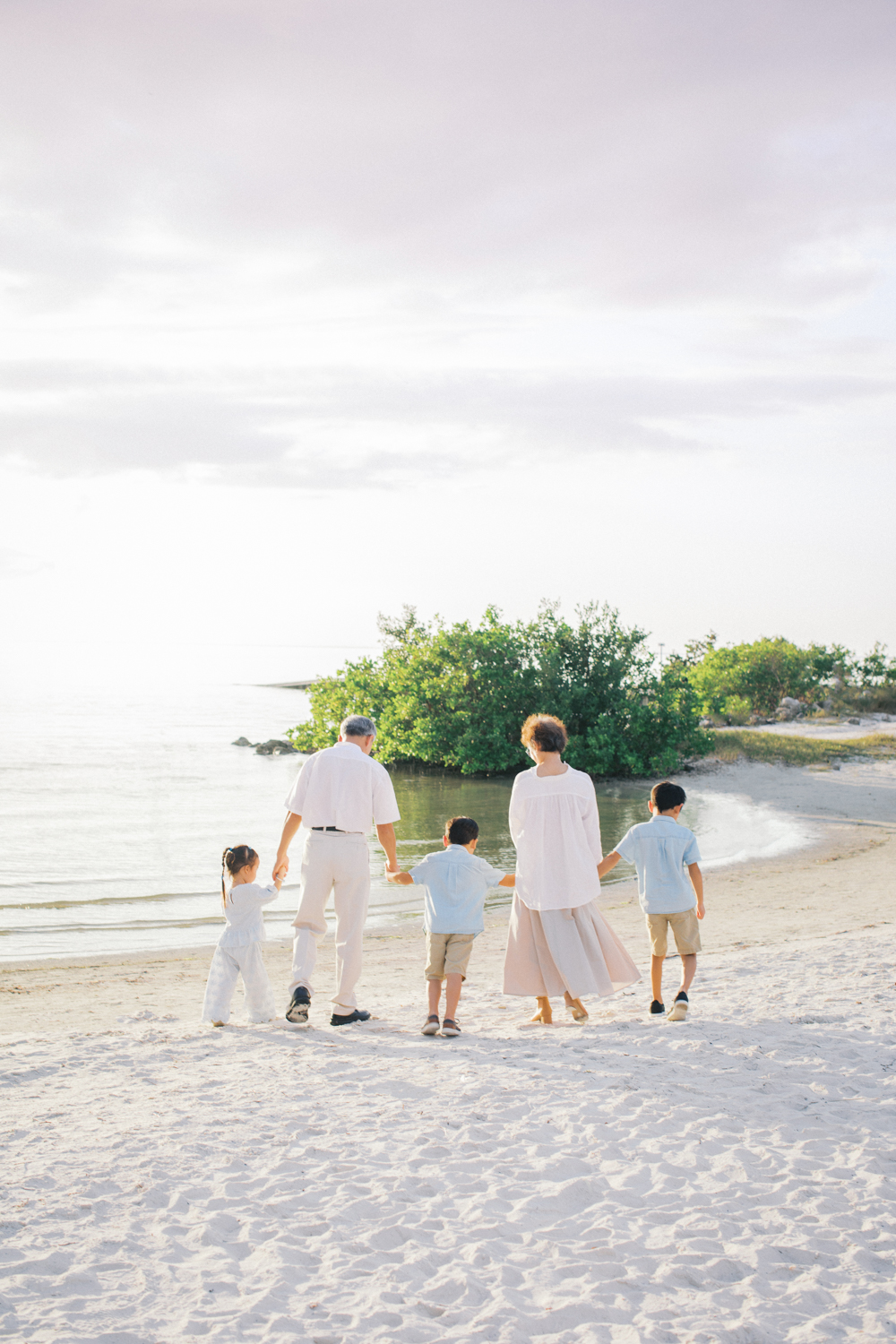 Grandparents and grandchildren sharing a candid moment during an extended family photo shoot in central Florida.