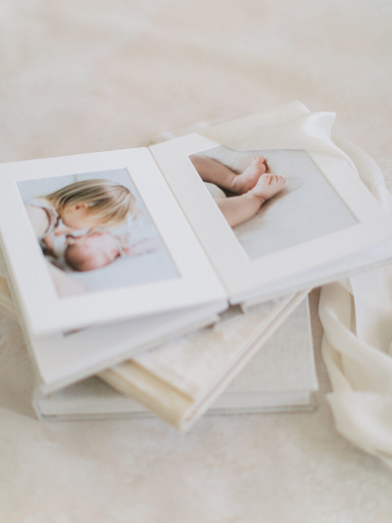 A handcrafted family photo album designed by Rooted Love Photography makes the perfect gift for grandparents.