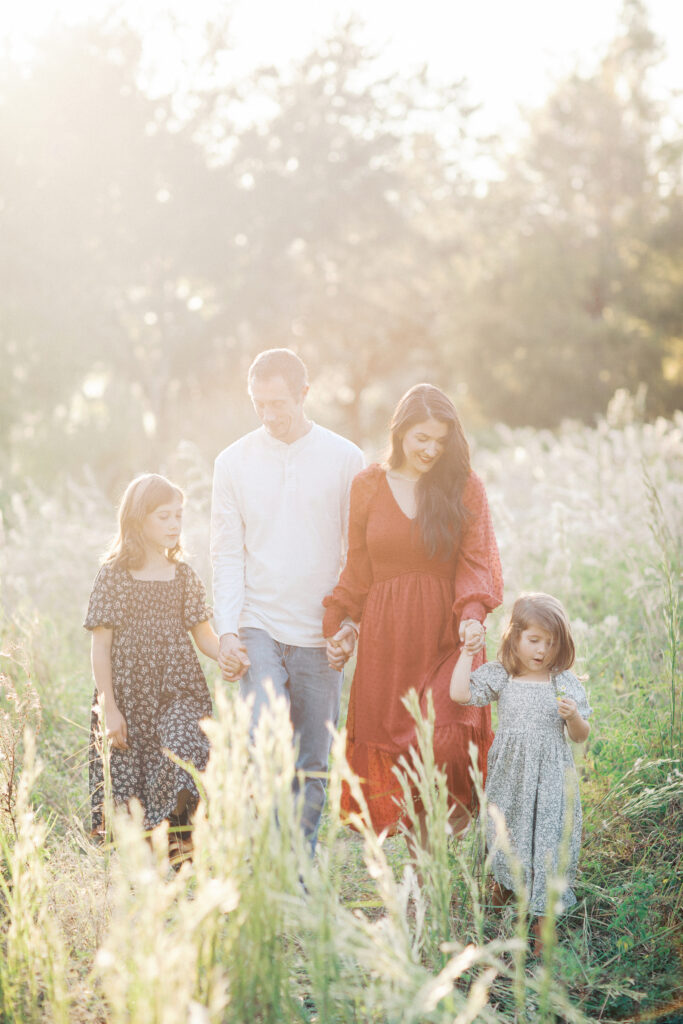 Family enjoying a fall evening together at sunset.