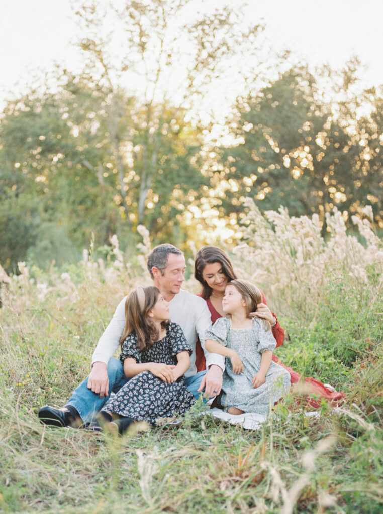 A sweet family loving on each other during a fall photo session in Orlando, FL.
