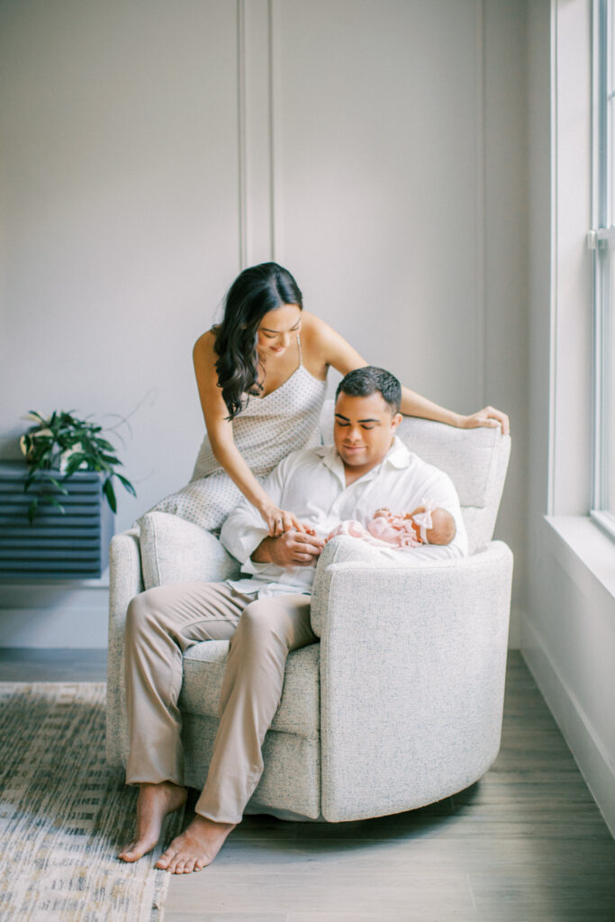 Orlando photographer guiding relaxed newborn photo session at home