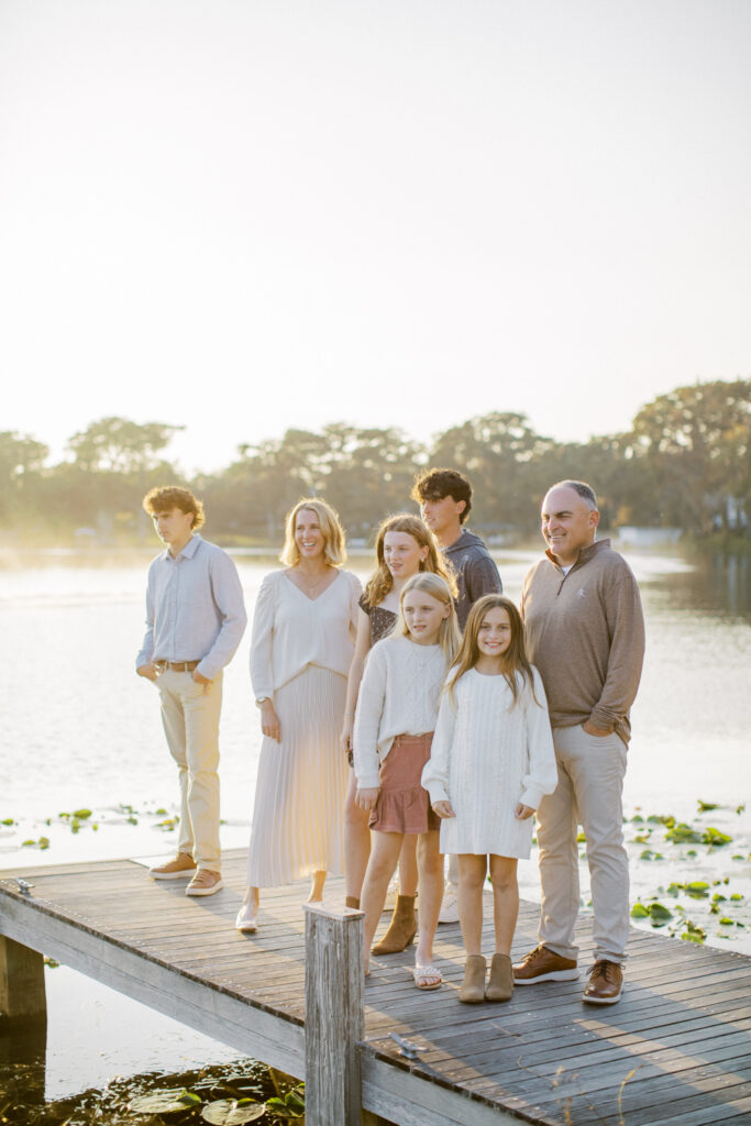 Family enjoying a playful moment during a photo session, capturing genuine laughter and connection.