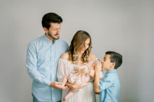 Family welcoming new baby home by Orlando newborn photographer.