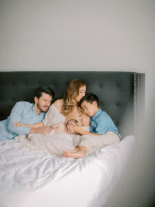 Family welcoming new baby home by Orlando newborn photographer.