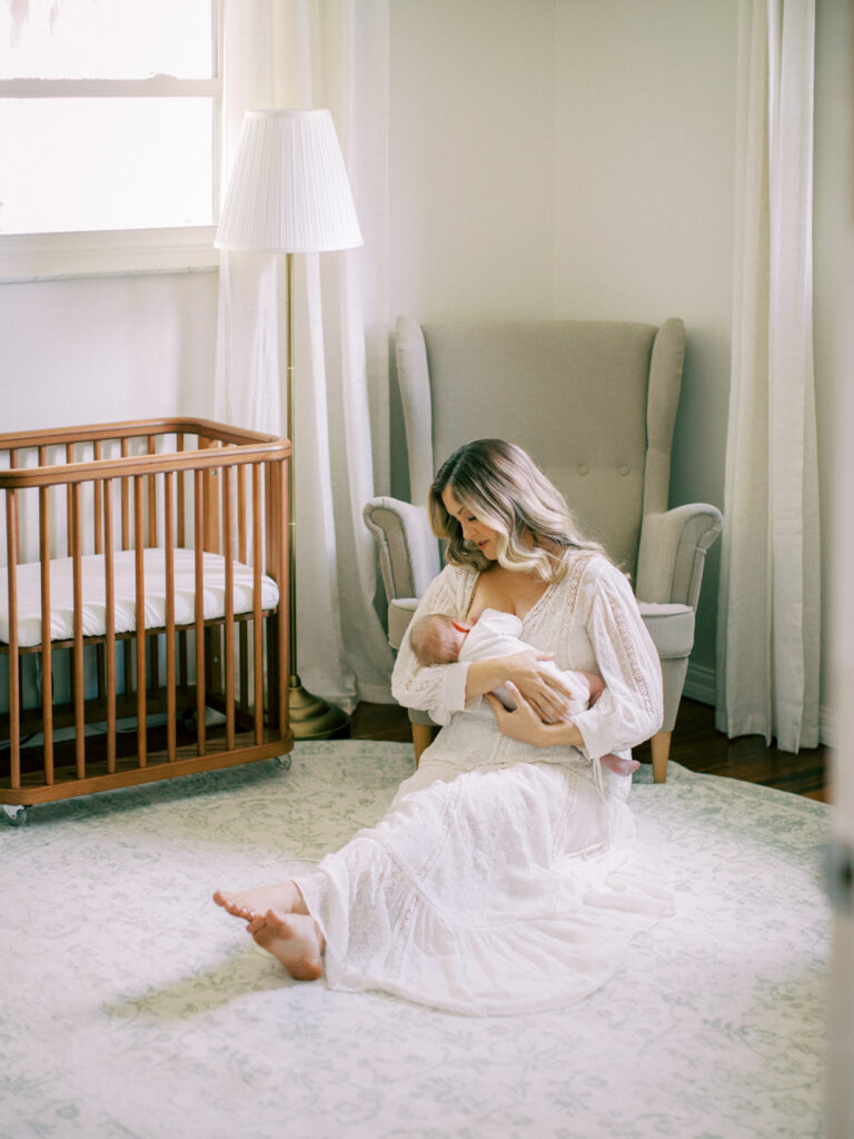 Mom and baby in the nursery by Orlando newborn photographer. 