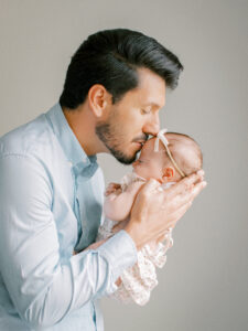Portrait of dad and his baby girl at home.