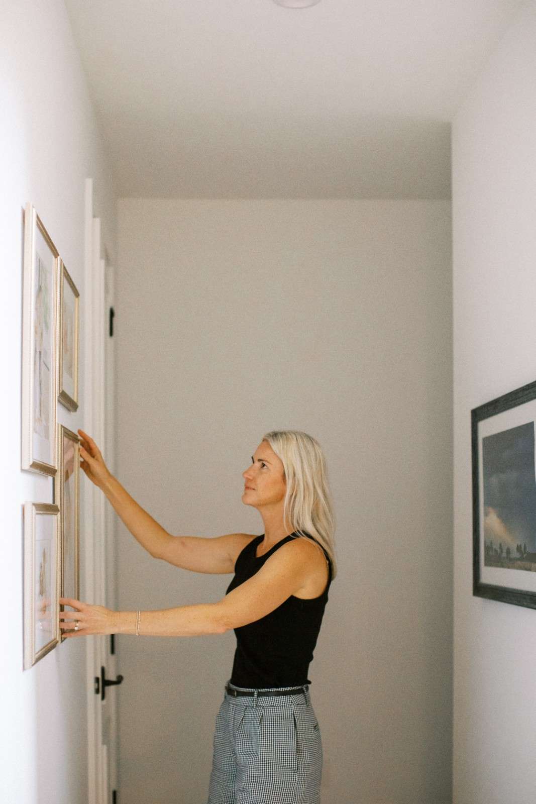 Custom gallery wall design and complimentary installation with Orlando family photographer.