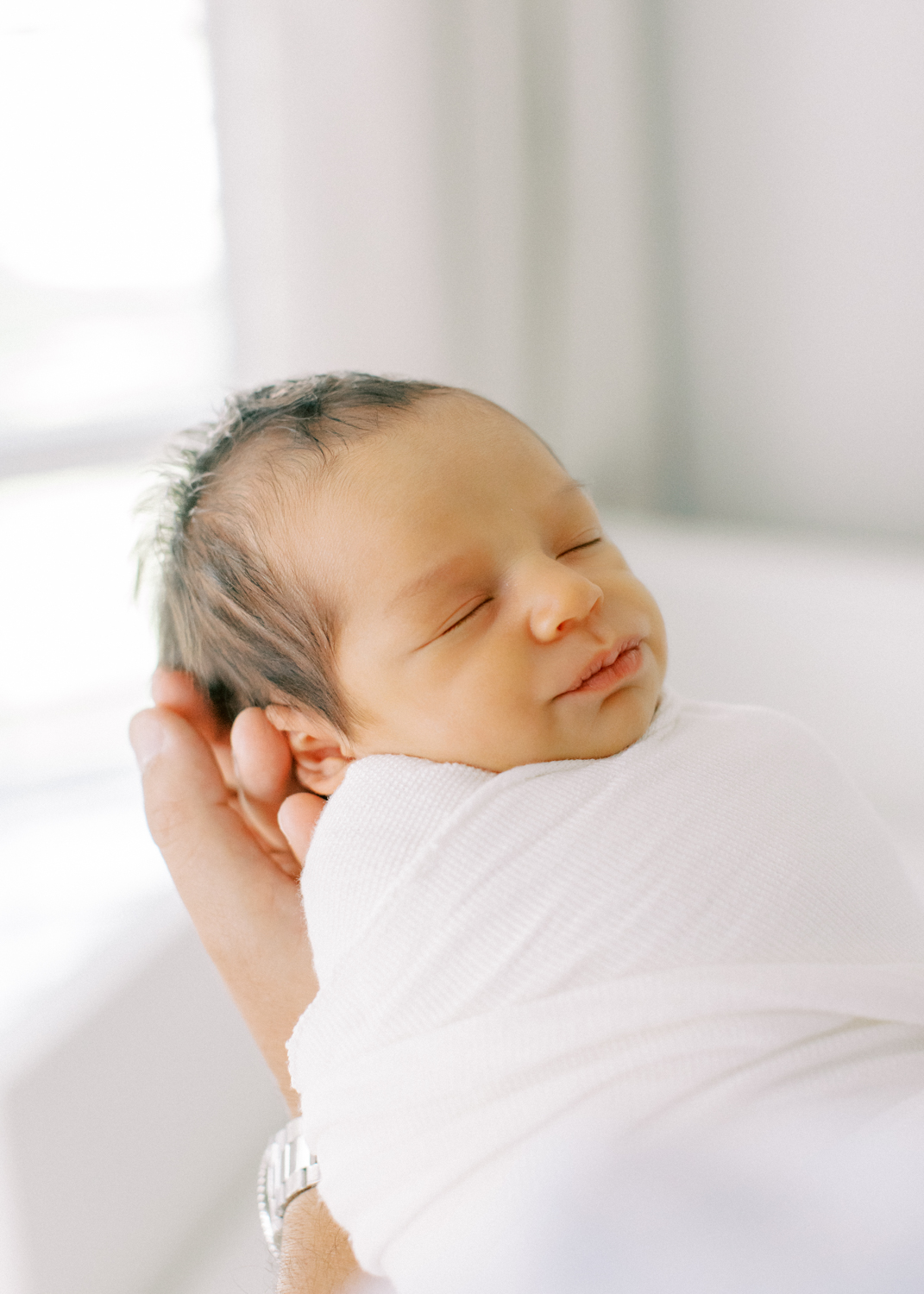 Light and airy in home newborn session in Orlando, FL.